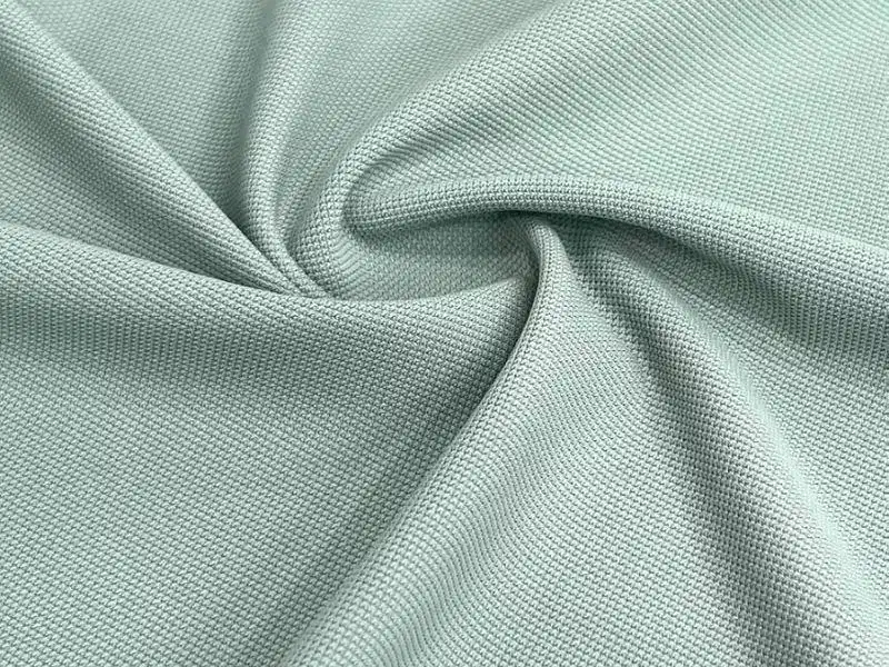 Vải pique cool poly Cận cảnh bề mặt vải pique cool sợi polyester tổng hợp