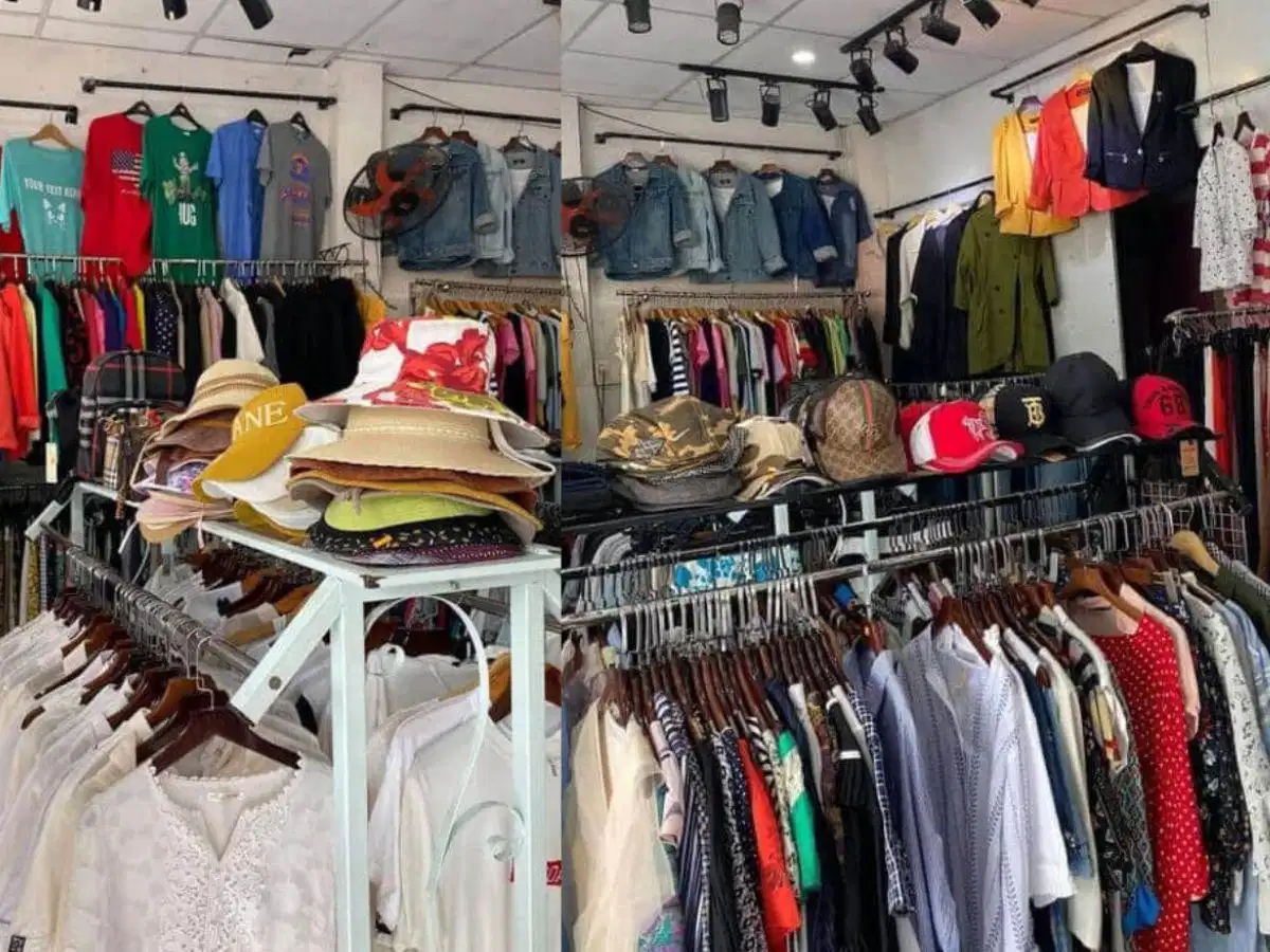 Quần áo secondhand đa dạng mẫu mã Quần áo secondhand trưng bày trên giá treo